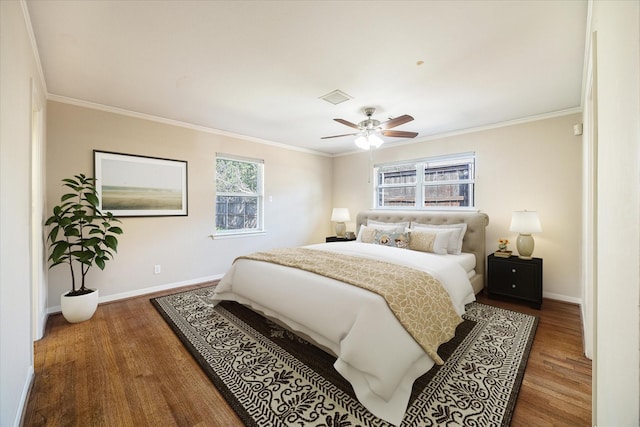 bedroom featuring wood-type flooring, ceiling fan, and crown molding