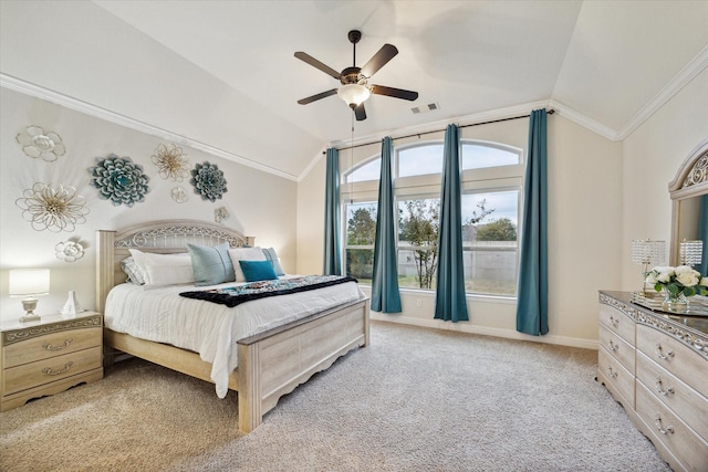 bedroom with ceiling fan, ornamental molding, light carpet, and vaulted ceiling