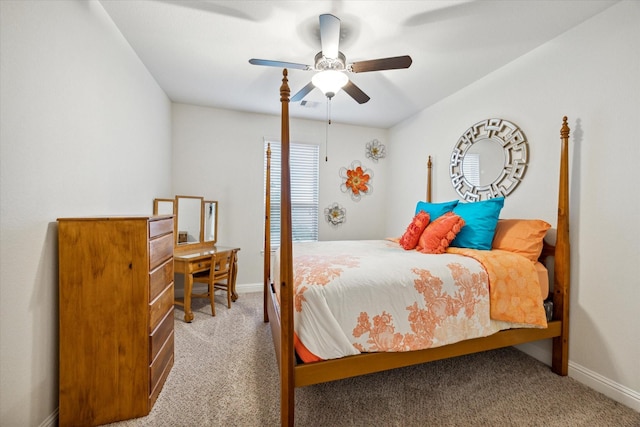 bedroom with ceiling fan and light colored carpet