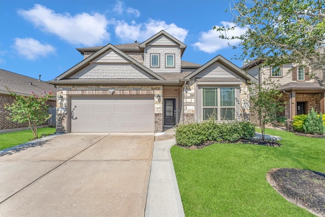 craftsman house featuring a front yard and a garage