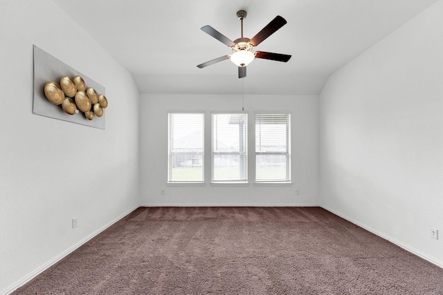 unfurnished room featuring carpet floors, vaulted ceiling, and ceiling fan