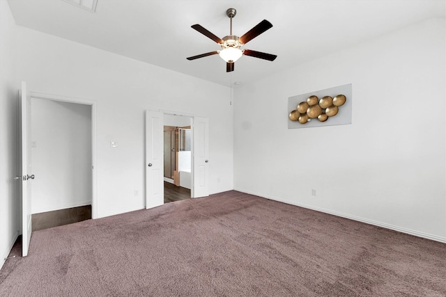 unfurnished bedroom featuring dark colored carpet and ceiling fan