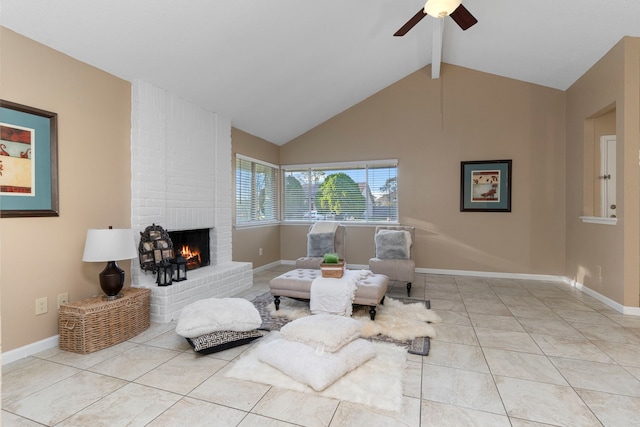 sitting room with a fireplace, lofted ceiling with beams, a ceiling fan, tile patterned flooring, and baseboards