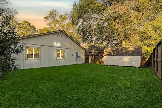 yard at dusk with a shed