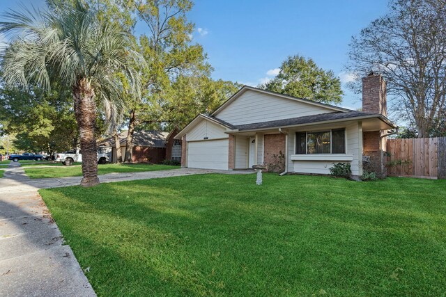 view of front of property featuring a garage and a front yard