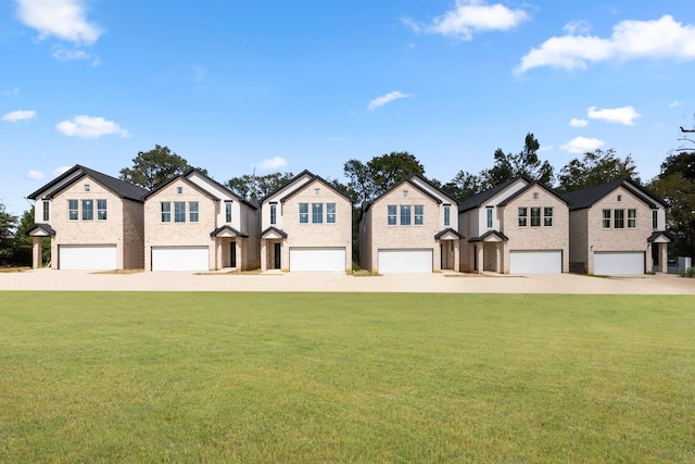 view of front of home featuring a front lawn and a garage