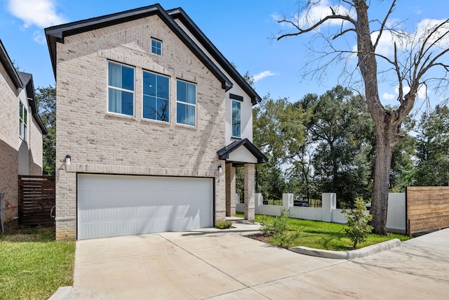 7934 Hennessy Ln Unit 2, Spring, TX 77389 - view of front of house with an attached garage, concrete driveway, and brick siding