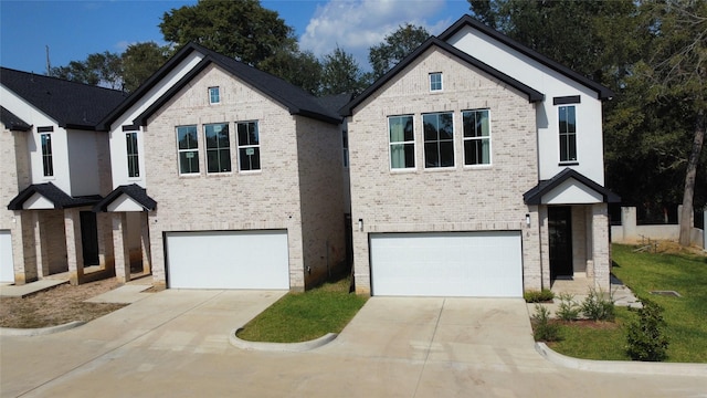 7934 Hennessy Ln Unit 2, Spring, TX 77389 - view of front facade featuring a garage, concrete driveway, and brick siding