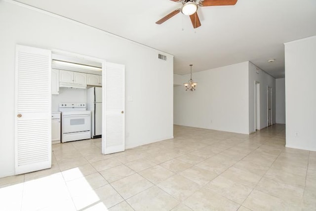 unfurnished room with ceiling fan with notable chandelier and light tile patterned floors