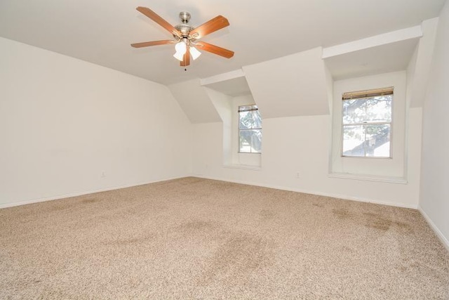 bonus room featuring ceiling fan, carpet floors, and lofted ceiling