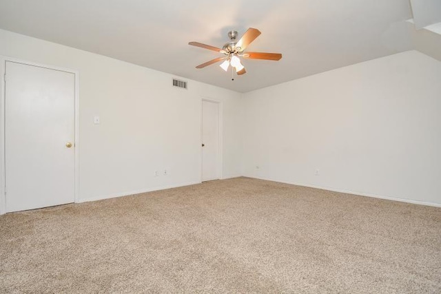 spare room with carpet and ceiling fan