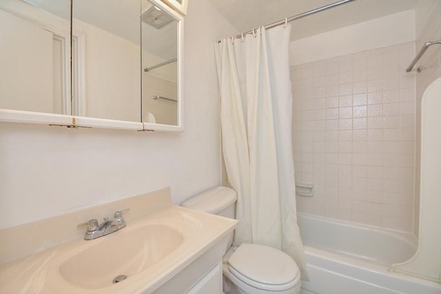 full bathroom featuring vanity, shower / bath combo, and toilet