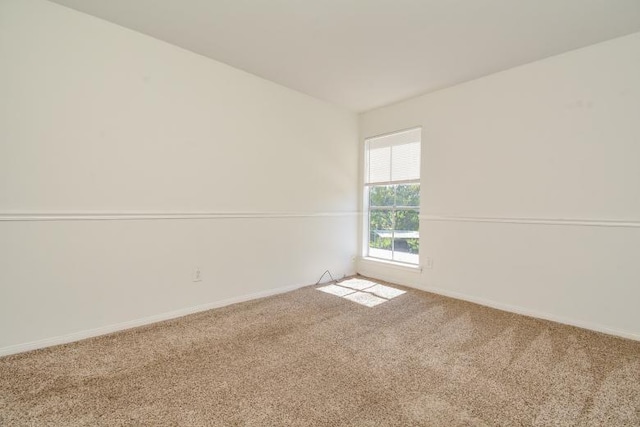 empty room featuring carpet flooring