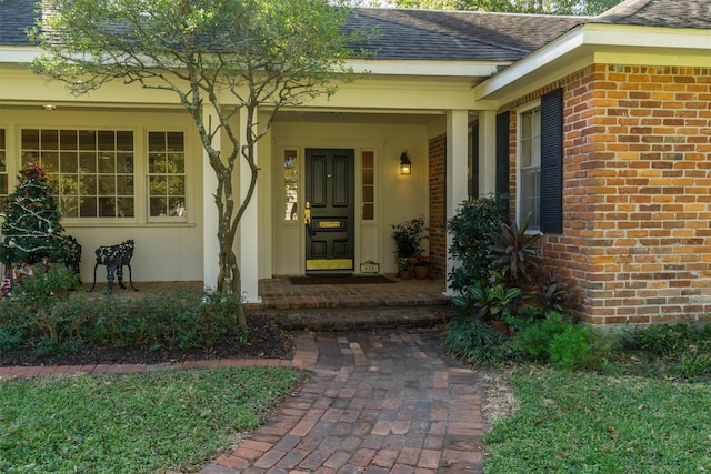 doorway to property featuring a porch