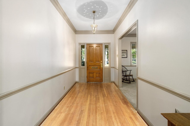 entrance foyer with crown molding and hardwood / wood-style flooring