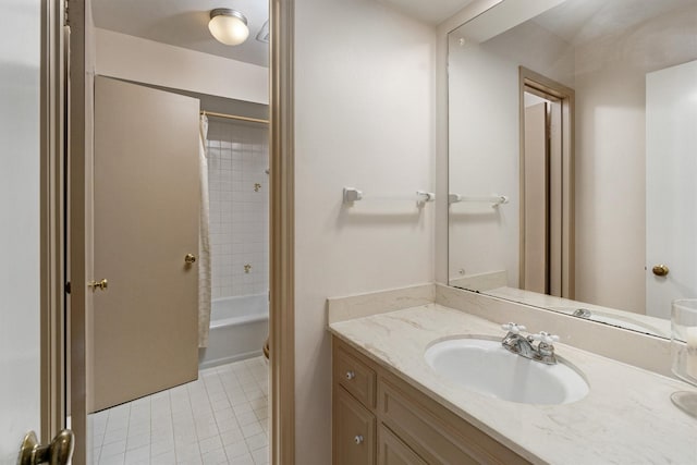 bathroom with vanity, tile patterned floors, and shower / bath combo with shower curtain