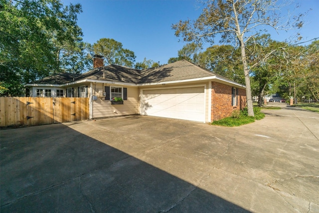 ranch-style home featuring a garage