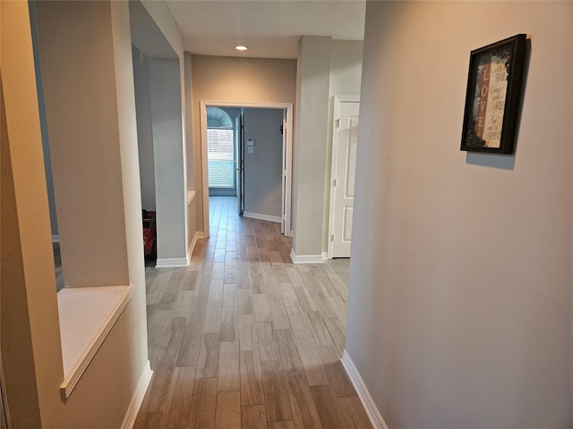 hall with light hardwood / wood-style floors