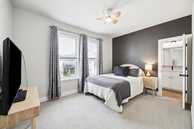 bedroom with ceiling fan and light colored carpet