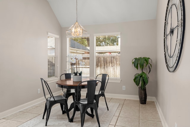 tiled dining space featuring vaulted ceiling and a notable chandelier