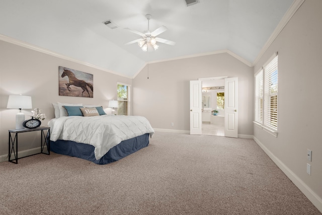 bedroom featuring ceiling fan, carpet floors, connected bathroom, and vaulted ceiling