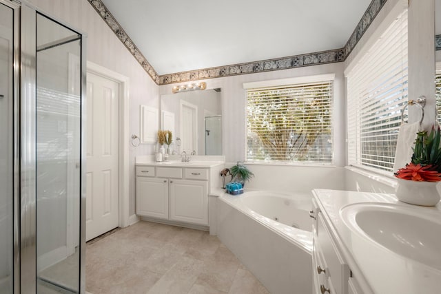 bathroom featuring separate shower and tub, tile patterned flooring, and vanity