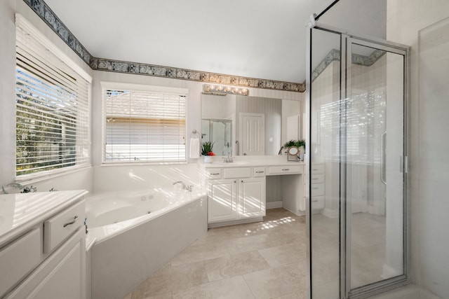 bathroom featuring tile patterned floors, vanity, and separate shower and tub