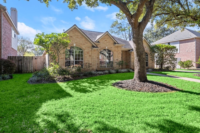 view of property with a front lawn