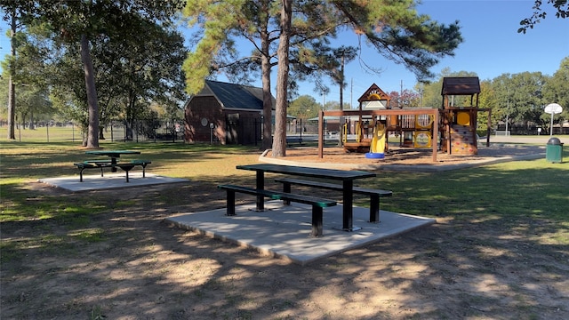 view of property's community featuring a playground and a yard