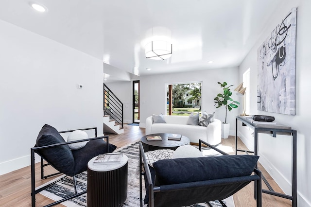 living room with light hardwood / wood-style flooring