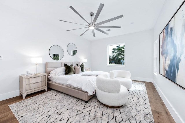 bedroom featuring hardwood / wood-style floors and ceiling fan