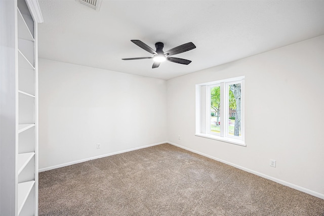 unfurnished room with ceiling fan and carpet floors