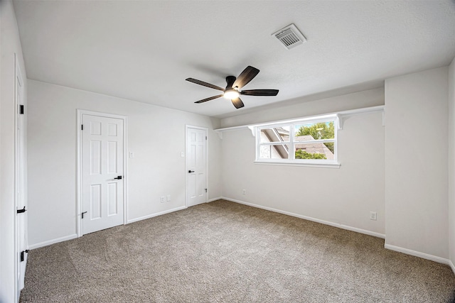 unfurnished bedroom featuring carpet flooring and ceiling fan