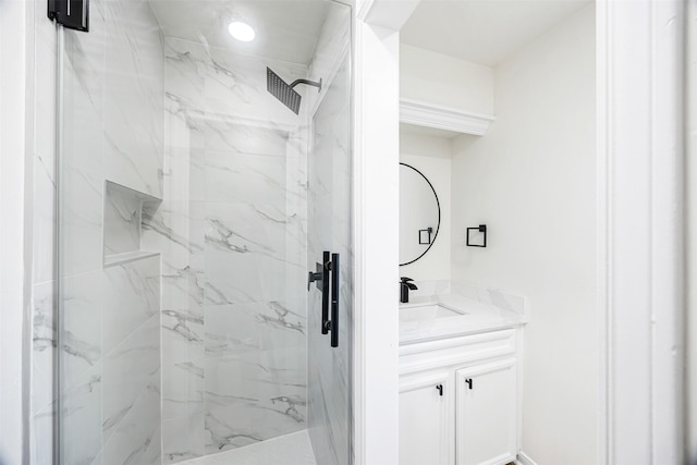 bathroom with vanity and a shower with door