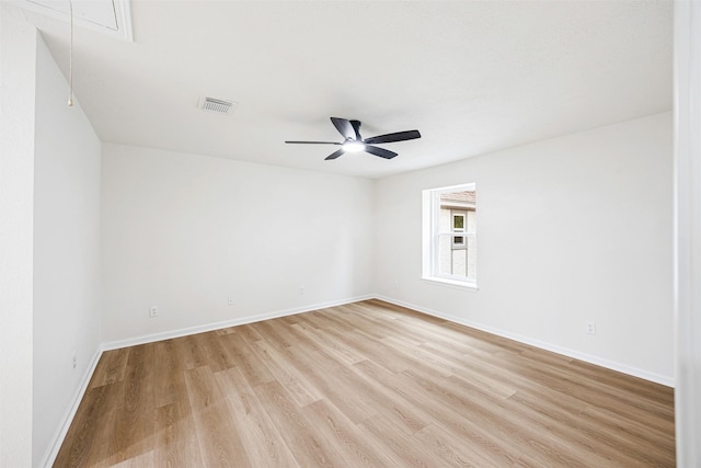 empty room with ceiling fan and light wood-type flooring