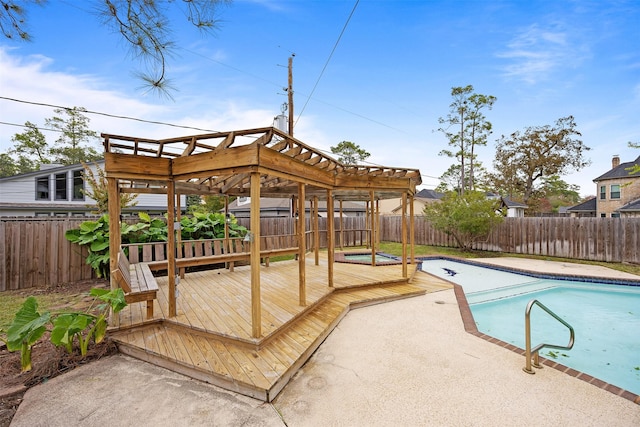 view of pool with a pergola and a wooden deck