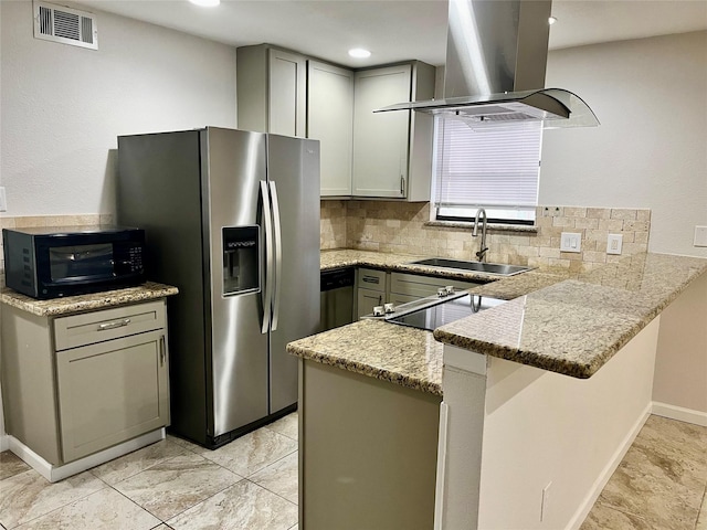 kitchen with kitchen peninsula, island exhaust hood, light stone countertops, and sink