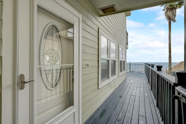 balcony featuring a water view