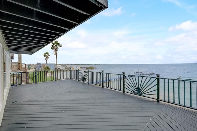 wooden deck with a water view