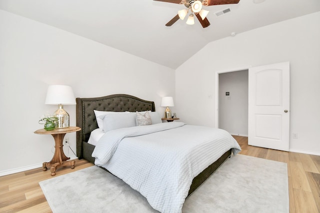 bedroom featuring hardwood / wood-style flooring, ceiling fan, and lofted ceiling