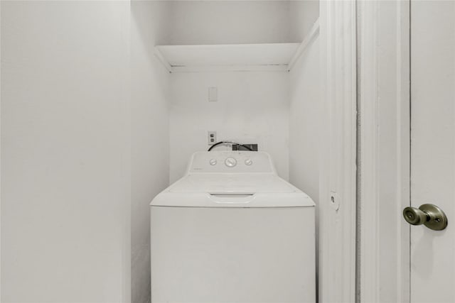 clothes washing area with washer / clothes dryer