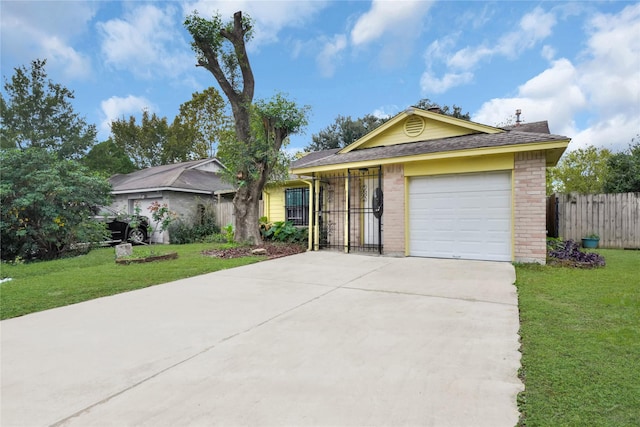 single story home featuring a garage and a front lawn