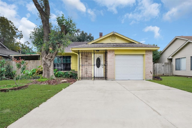 ranch-style home featuring a front lawn and a garage