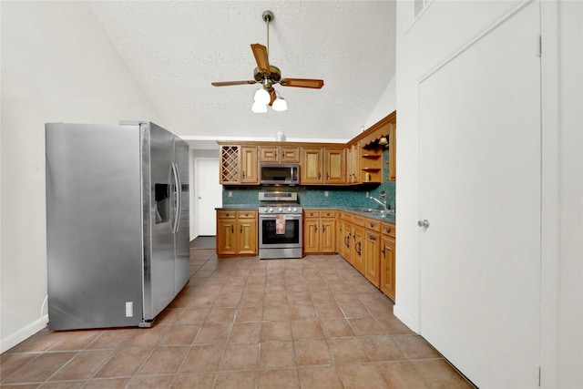 11907 E Marsham Cir, Houston, TX 77066 - kitchen featuring appliances with stainless steel finishes, tasteful backsplash, open shelves, ceiling fan, and light tile patterned floors