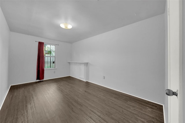 empty room featuring dark hardwood / wood-style floors