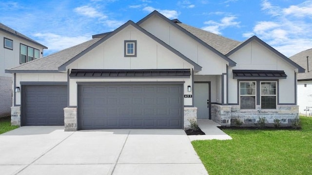 view of front facade with a garage and a front lawn