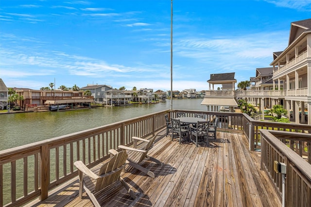 view of dock with a deck with water view