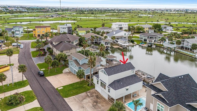 birds eye view of property with a water view