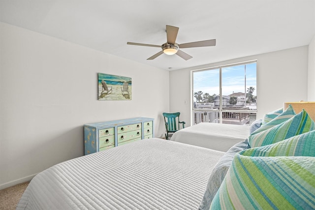 bedroom featuring carpet floors, access to outside, and ceiling fan