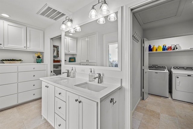 bathroom with vanity and washing machine and clothes dryer